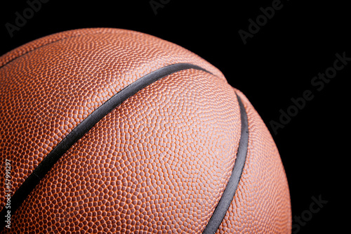 Basketball ball against dark background photo