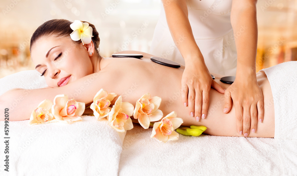 Woman having massage of body in spa salon