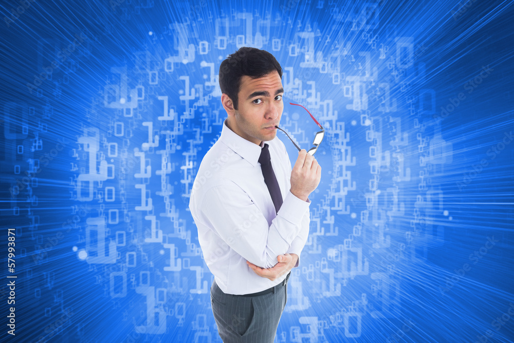 Composite image of unsmiling businessman holding glasses Composite image of unsmiling businessman holding glasses