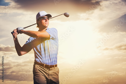 Golfer at sunset