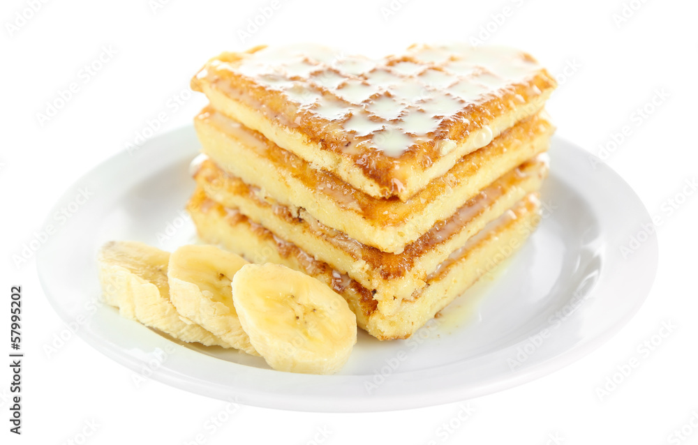 Sweet Belgium waffles with banana, isolated on white Sweet Belgium waffles with banana, isolated on white