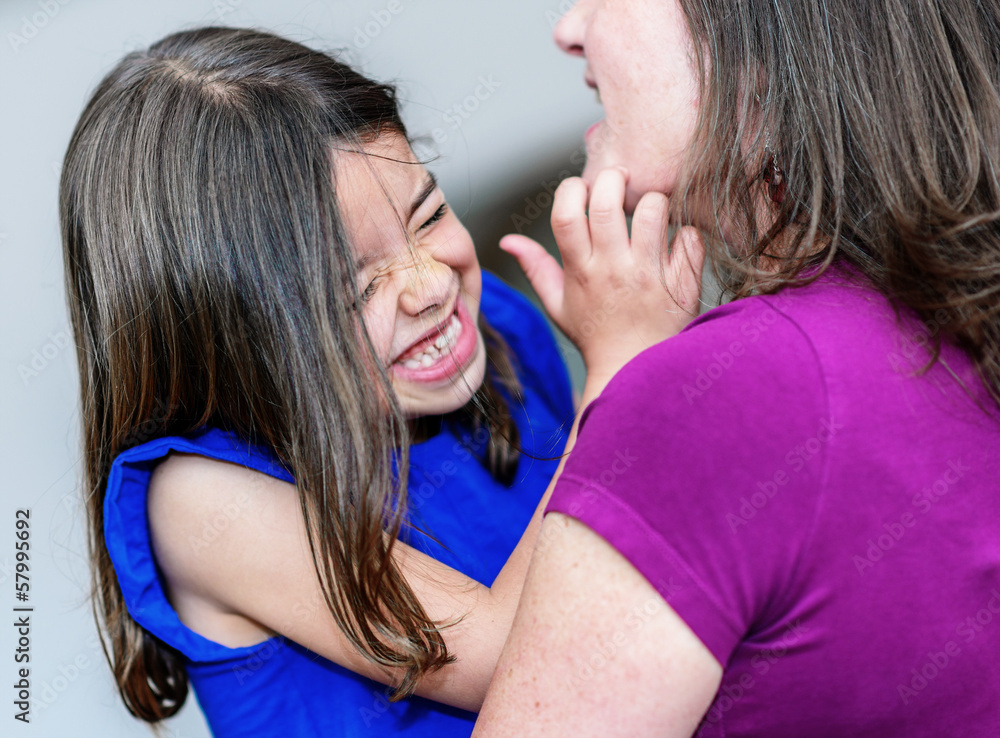 complicity between a very cute little girl and her mother