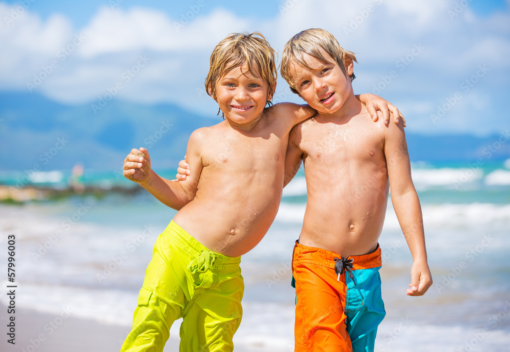 Two young boys having fun on tropcial beach Two young boys having fun on tropcial beach