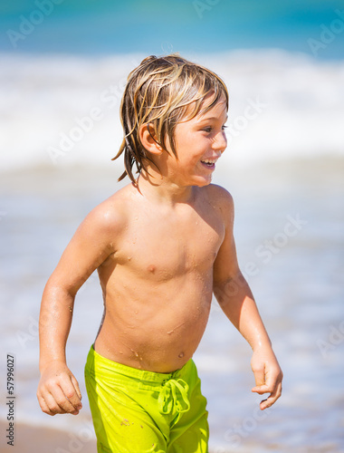 Happy young boy at the beach