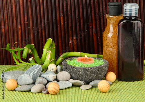 Still life with green bamboo plant and stones,