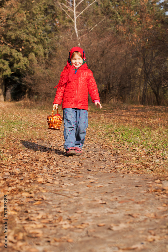 Funny little girl with a basket with mushrooms Funny little girl with a basket with mushrooms