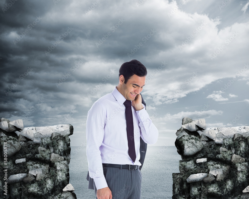 Fototapeta premium Composite image of smiling businessman standing