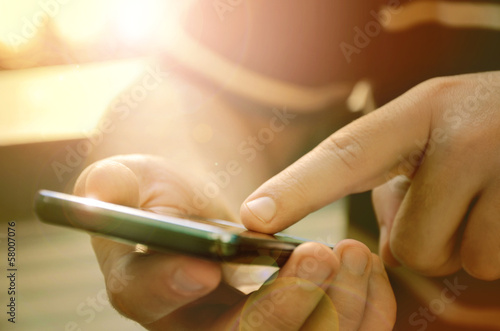 Man using mobile smart phone outdoor