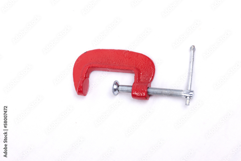 Фотография Red clamp on a white background