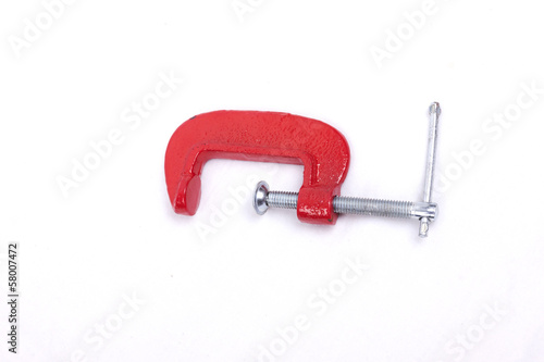 Red clamp on a white background