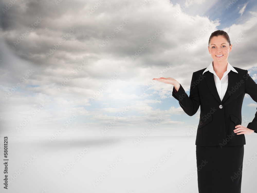 Composite image of charming woman in suit showing a copy space Composite image of charming woman in suit showing a copy space