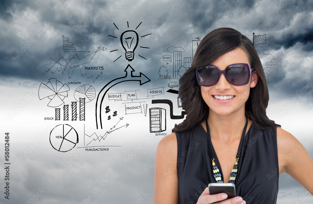 Composite image of happy brunette holding smartphone Composite image of happy brunette holding smartphone