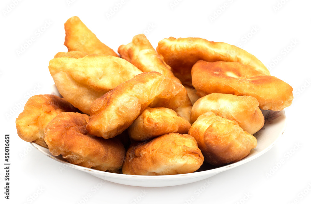 Russian patties in the plate on white background