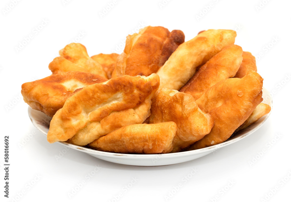 Russian patties in the plate on white background Russian patties in the plate on white background