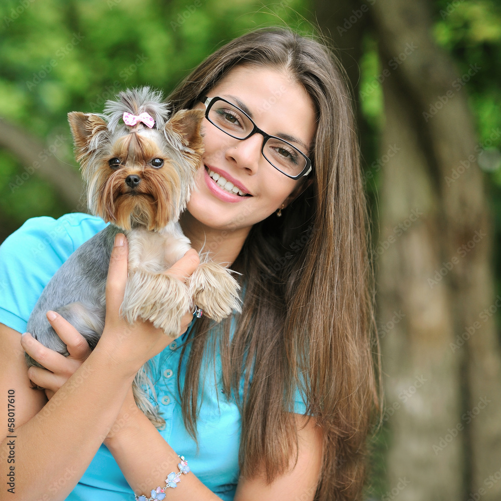 Young beautiful girl with her puppy outdoor Young beautiful girl with her puppy outdoor
