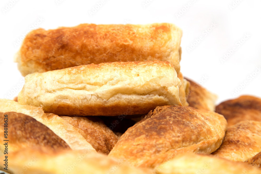 fresh tasty meat pies on a white background