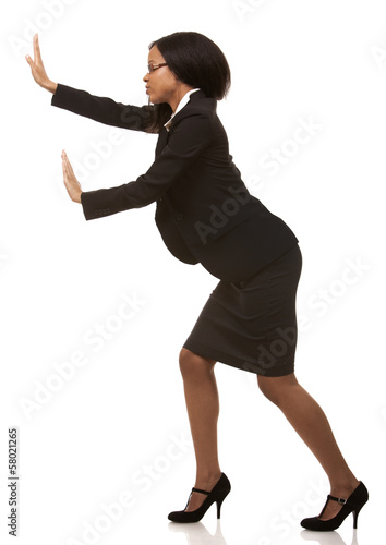 business woman pushing invisible object