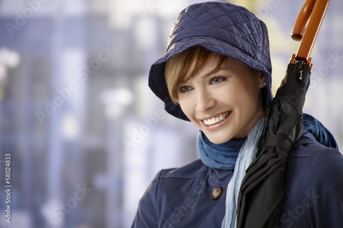 Attractive young woman with umbrella photo