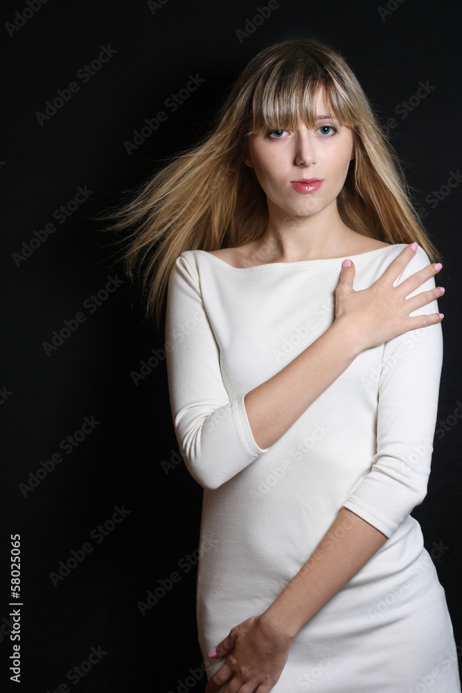 Fashion portrait of confident slim girl in white dress ,studio Fashion portrait of confident slim girl in white dress ,studio
