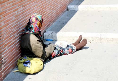Photography Gypsy with lurid clothes while begging on the street
