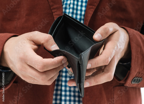 man holding an empty wallet © slasnyi