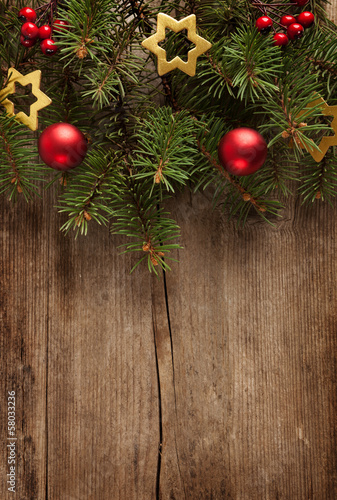 Old grunge wooden board with Christmas border.