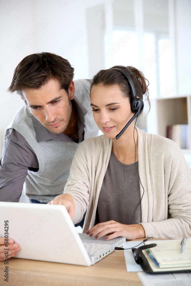 Business people working in customer service department Business people working in customer service department