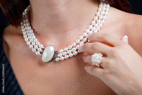 Fototapeta Woman with pearl necklace on her neck