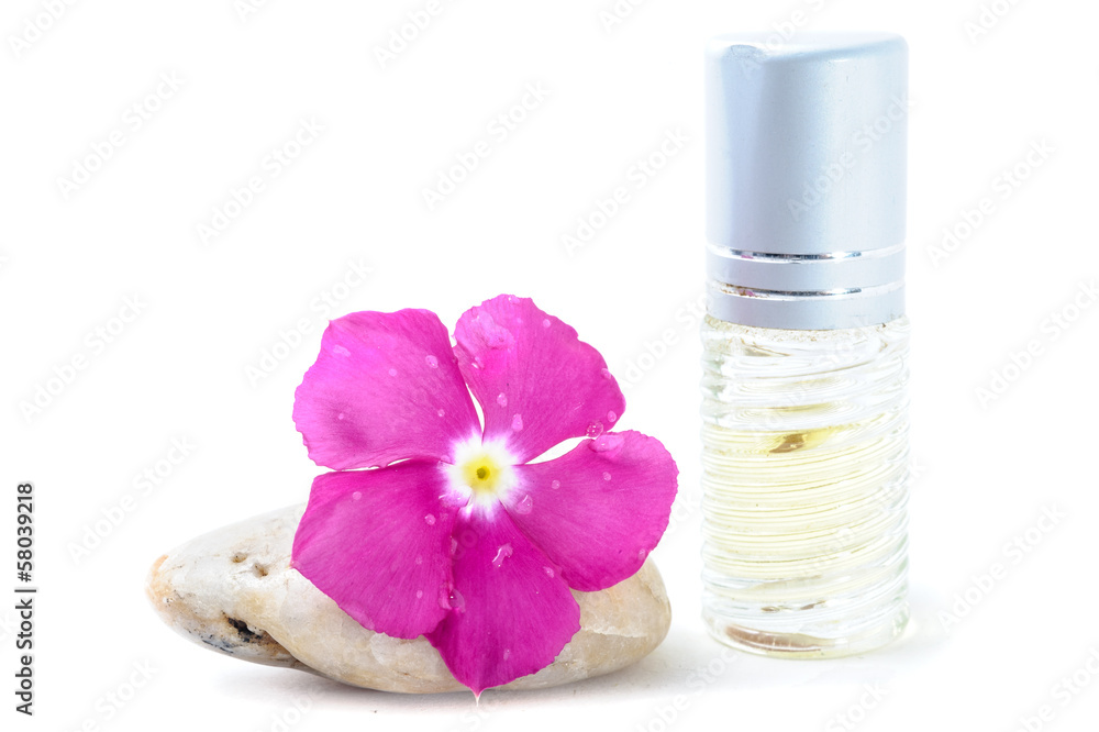 Generic Perfume and Purple Flower on stone, white background Generic Perfume and Purple Flower on stone, white background