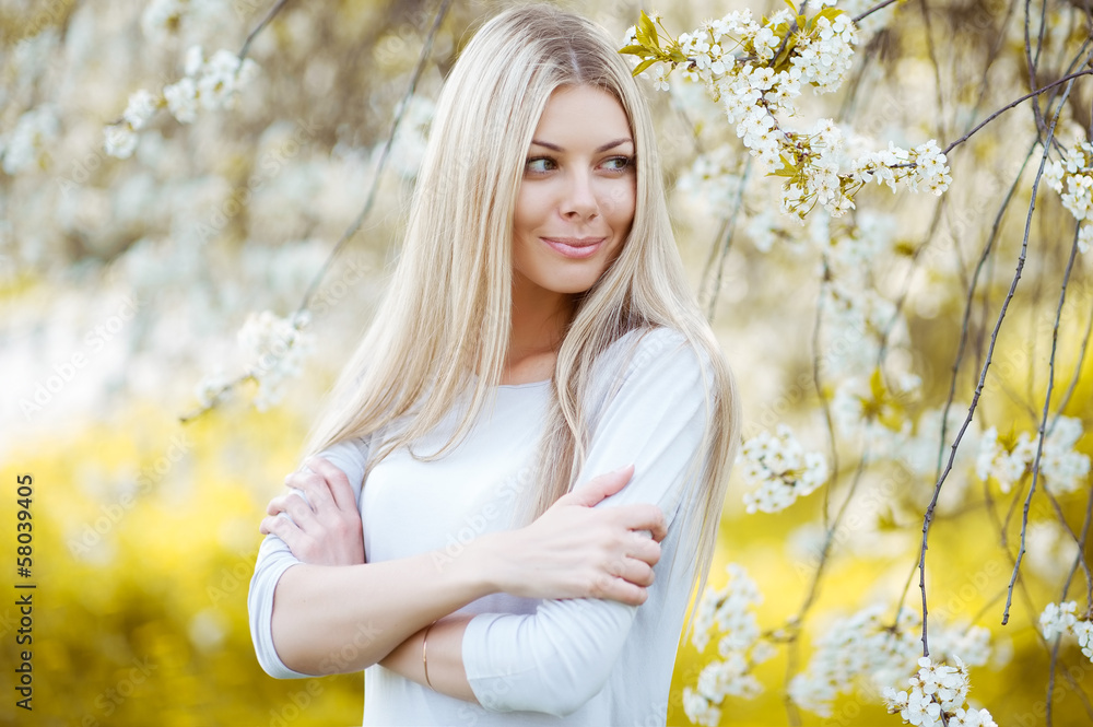 Young woman on blossom background Young woman on blossom background