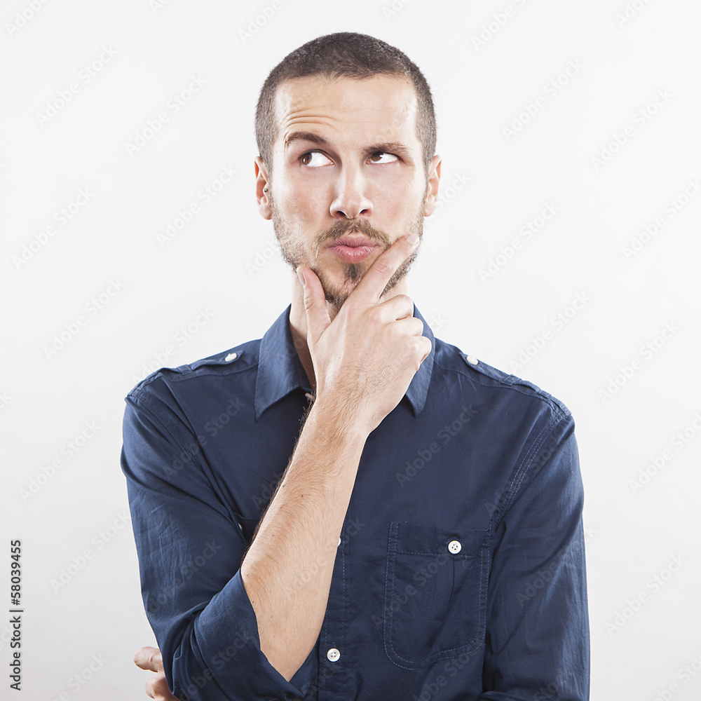 Portrait of handsome young thoughtful man isolated over white ba Portrait of handsome young thoughtful man isolated over white ba