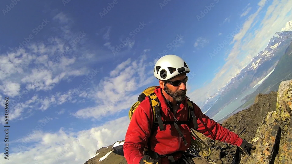 Climber filming selfie to post online, Alaska, USA Climber filming selfie to post online, Alaska, USA