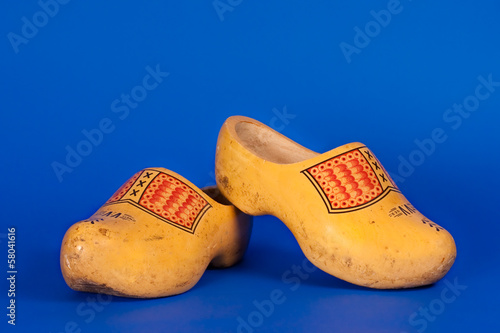 Dutch clogs isolated on blue