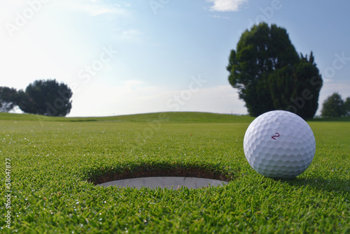golf hole and ball