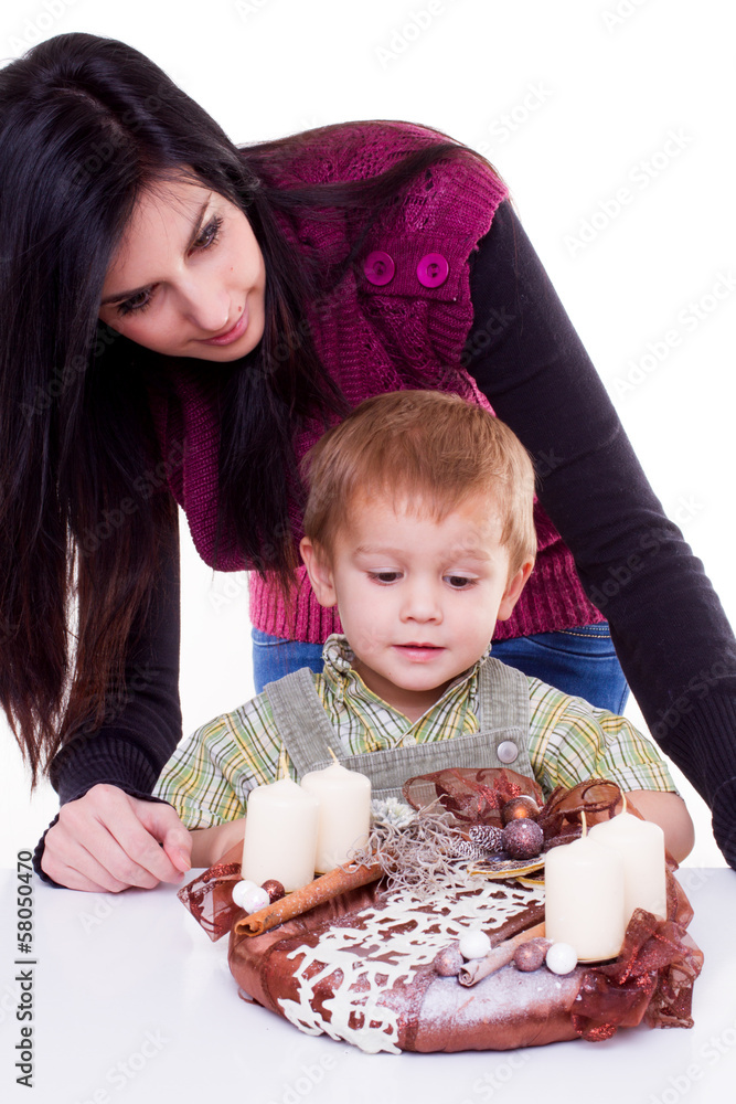 young women with a little boy with advent wreath
