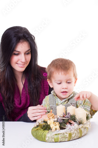 young women with a little boy with advent wreath