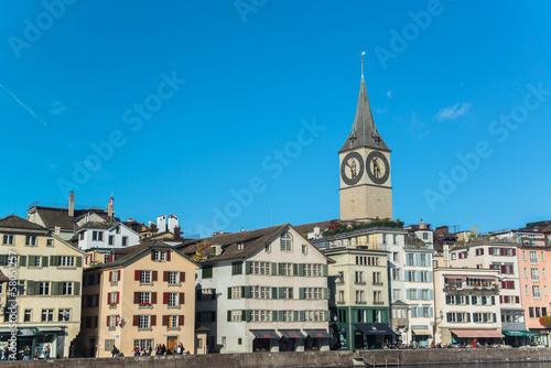 Clock tower over the buildings in Zurich, Switzerland