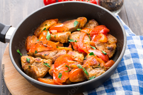 Fried pork with pan-roasted tomatoes
