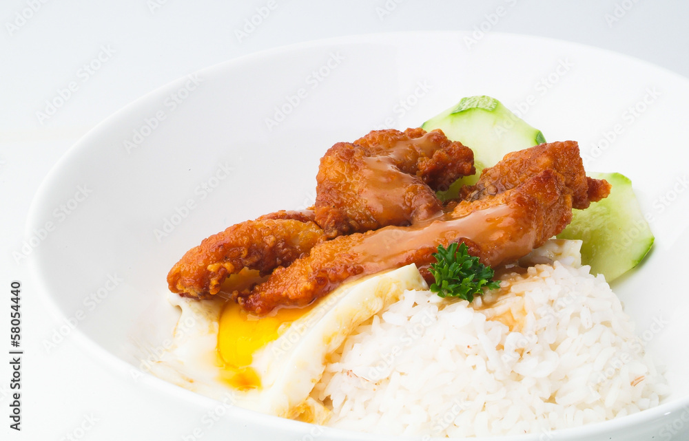 Chicken with rice and vegetables in background Chicken with rice and vegetables in background