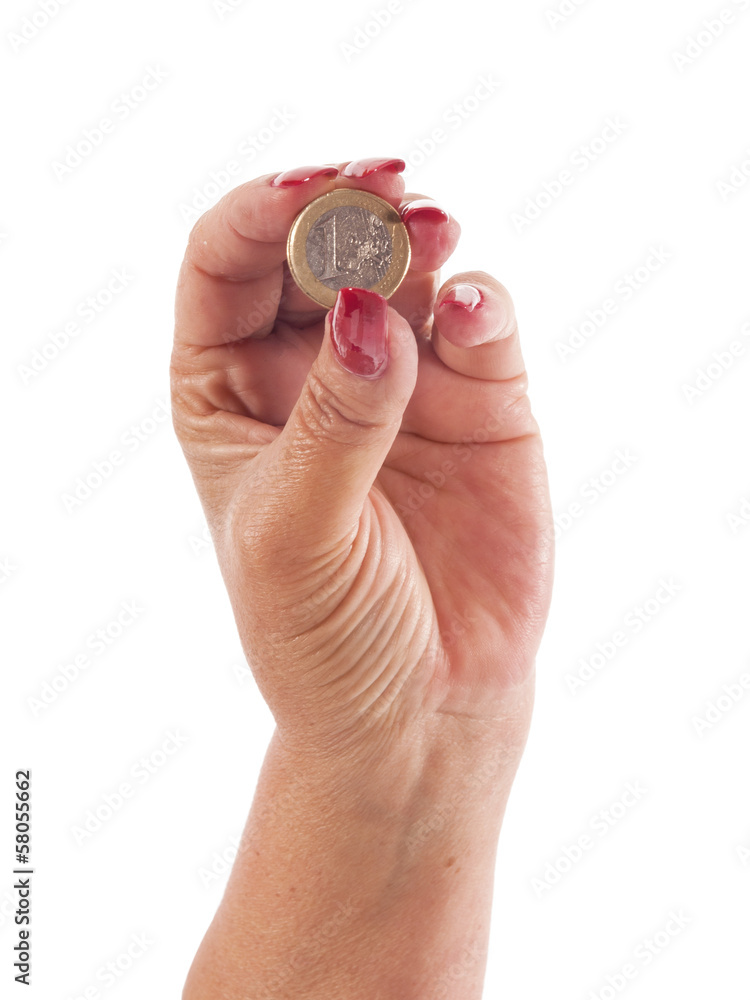 woman hand with euro coin between the fingers woman hand with euro coin between the fingers