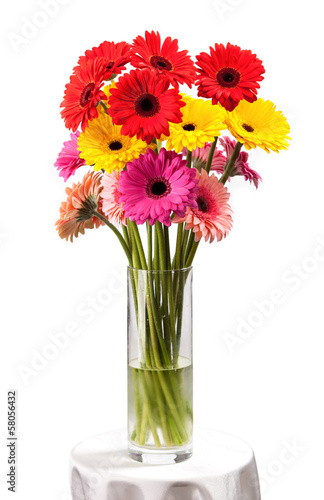 Gerbera flowers in vase isolated on white background