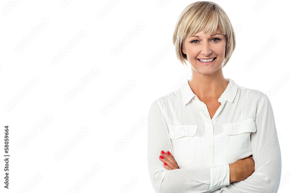 Smiling middle aged lady, arms crossed. Smiling middle aged lady, arms crossed.