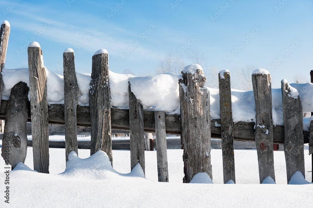 Old fence in the snow Old fence in the snow