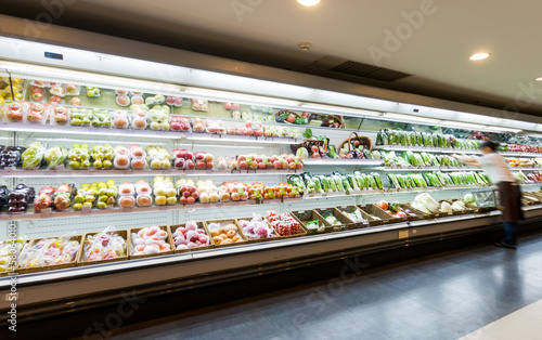 Shelf with fruits in supermarket photo