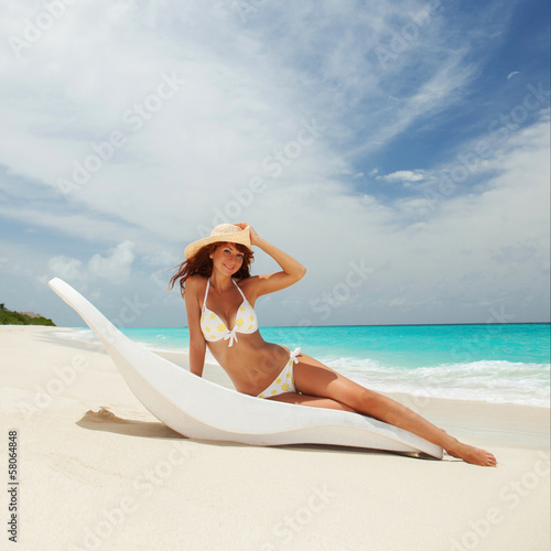 Pretty woman relaxing on the beach
