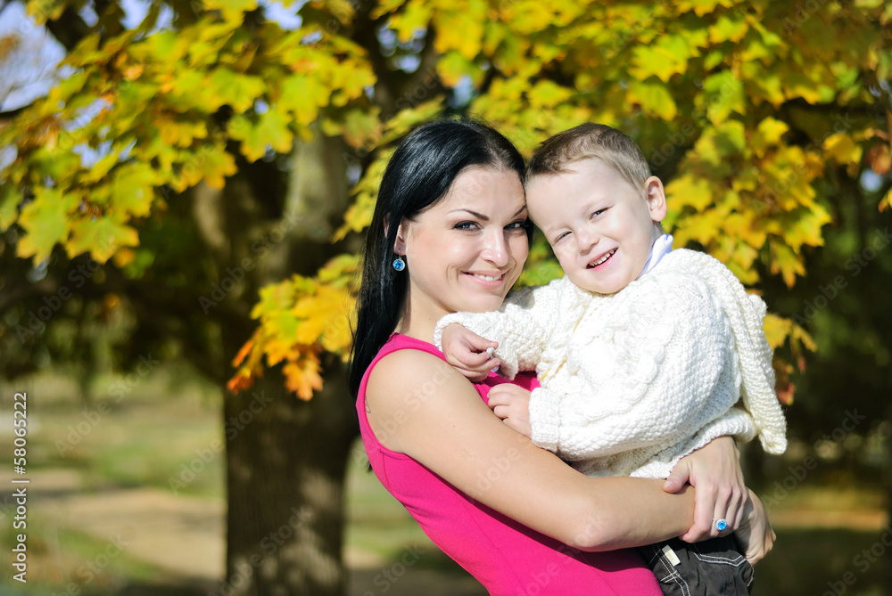 little boy with his mother in autumn park little boy with his mother in autumn park