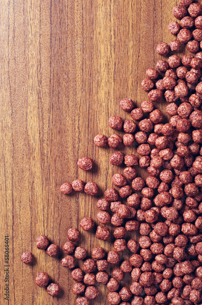 Chocolate cereals on wooden table Chocolate cereals on wooden table