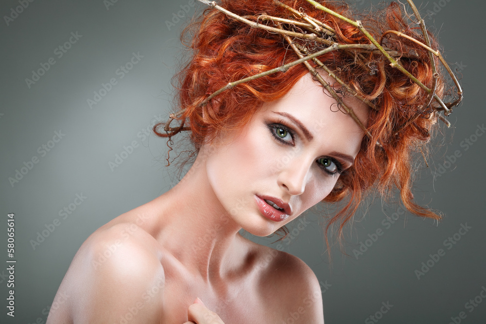 Red hairs. Beautiful girl in a chaplet from branches. Red hairs. Beautiful girl in a chaplet from branches.