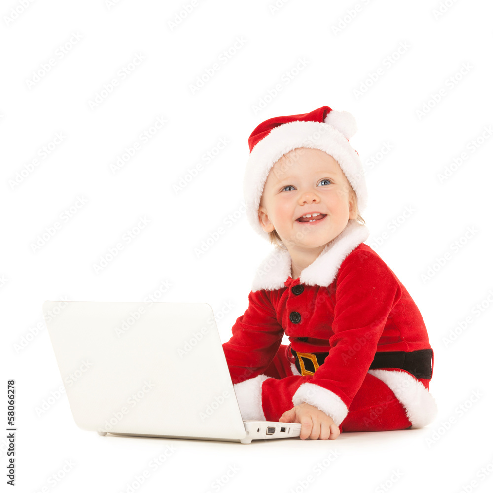 Cute santa baby with laptop on the white background Cute santa baby with laptop on the white background