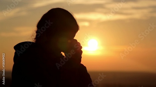 girl silhouette at dawn (close-up) photo